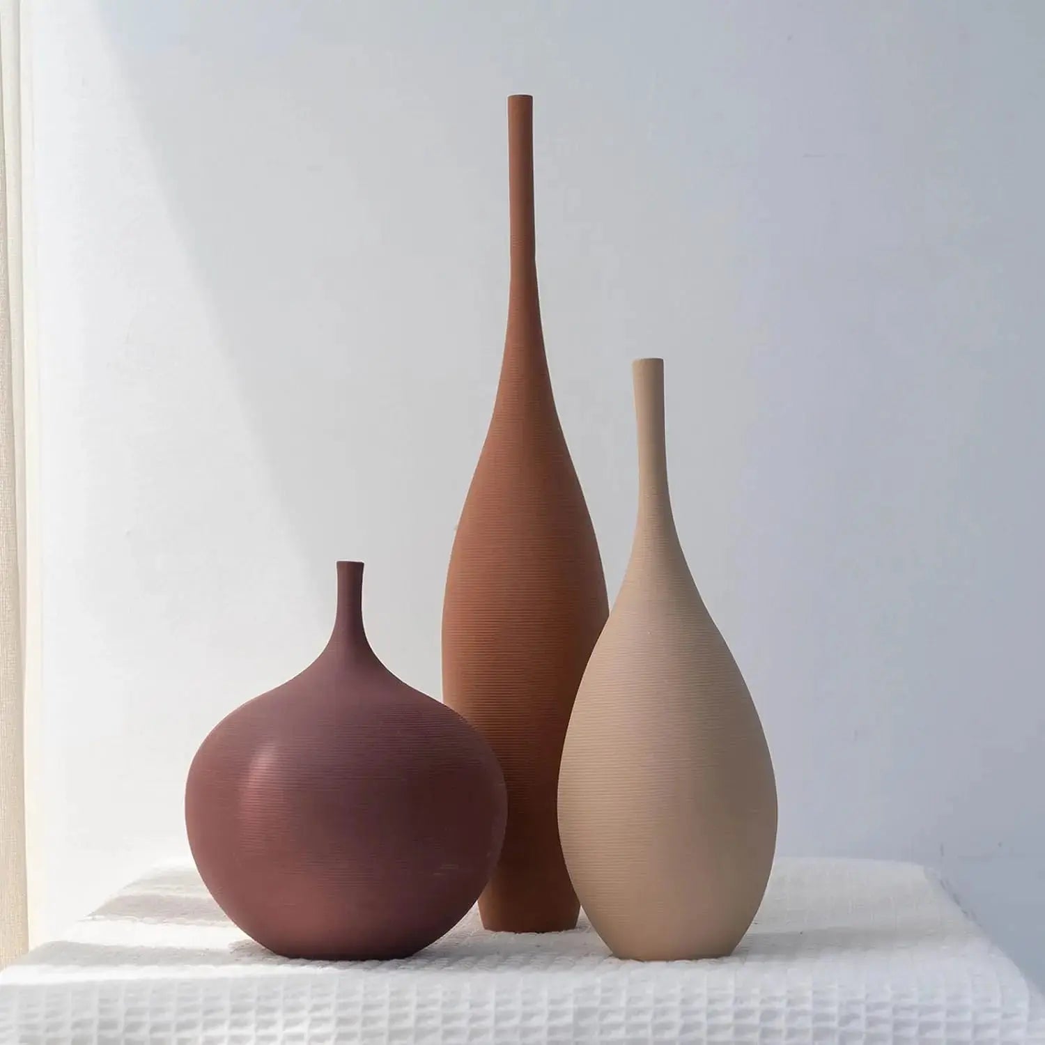 Trio of Earth-Tone Ribbed Ceramic Vases comfydesigners